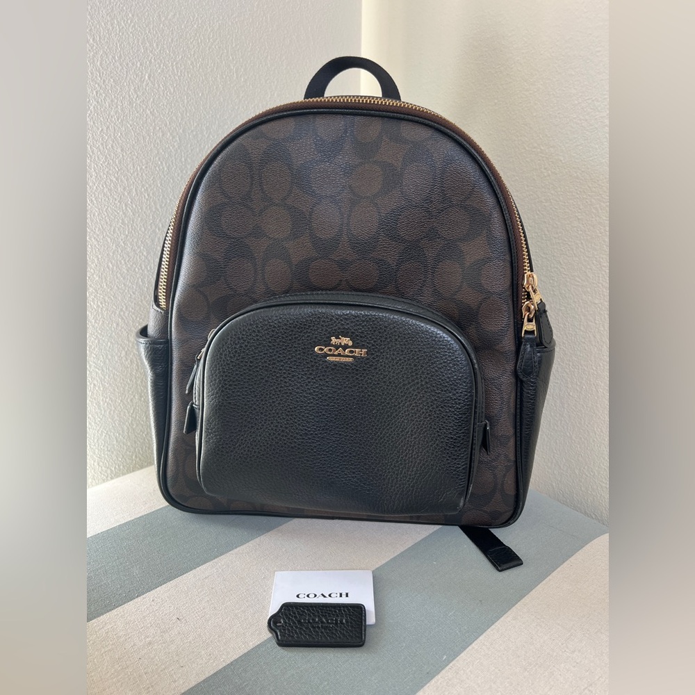 Coach canvas dark brown and black backpack purse. Great condition!